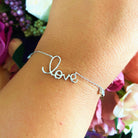 Bratara din argint 925 rodiat cu scris "Love" si charms-uri cu diamante CZ albe Bratara Lasardo Gioielli