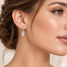 Cercei dama din argint 925 rodiat cu diamante CZ albe claritate AAAAA montate micropave, 17.4 mm la urechea unui model feminin elegant