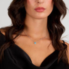 colier din argint 925 rodiat brand morellato cu pandantiv acvamarin si halo de diamante cz purtat la gat