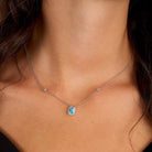 colier din argint 925 rodiat brand morellato cu pandantiv acvamarin si halo de diamante cz la gat