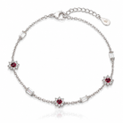 Bratara din argint 925 rodiat cu lantisor fin, trei motive florale din rubine CZ rosii si patru elemente rectangulare cu diamante CZ albe baguette cut