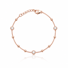  Bratara de dama din argint 925 finisaj rose gold dispusa in forma circulara cu trei cristale rotunde incastrate si sfere metalice lucioase.