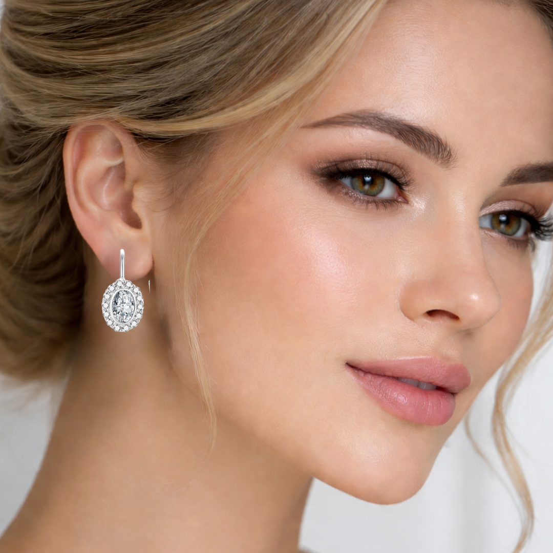 cercei tortita din argint 925 rodiat cu diamante cz oval cut la ureche