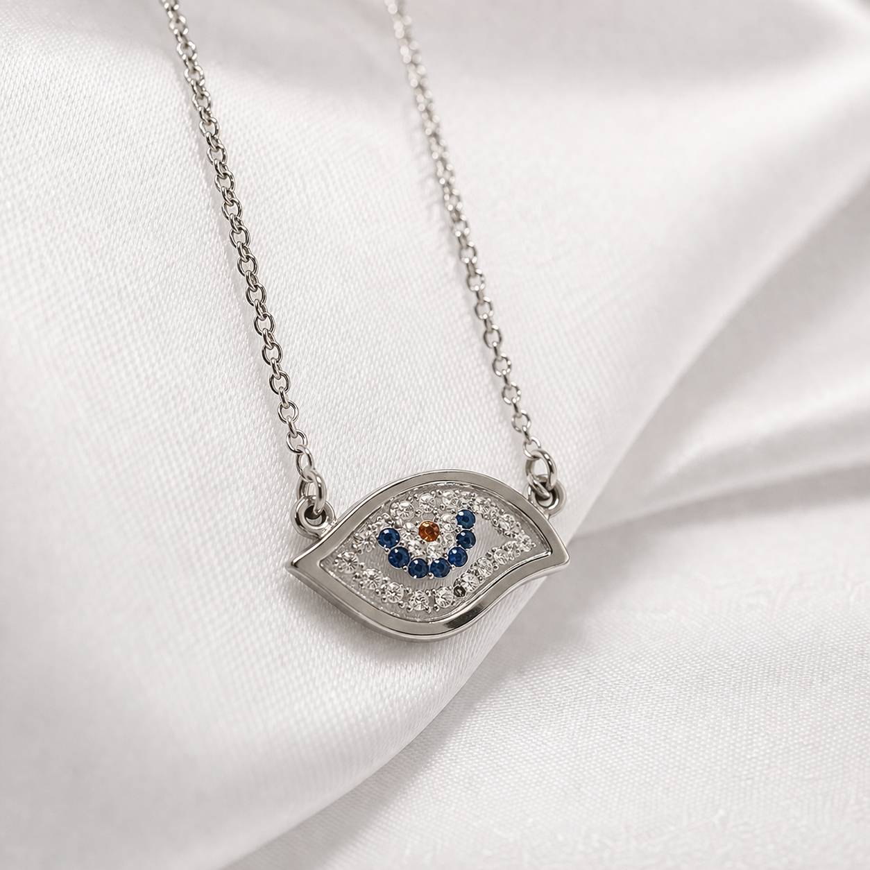 Colier statement din argint 925 rodiat cu pandantiv mare de 2 cm reprezentand simbolul Evil Eye, incrustat integral cu diamante CZ albe si albastre, imagine close up